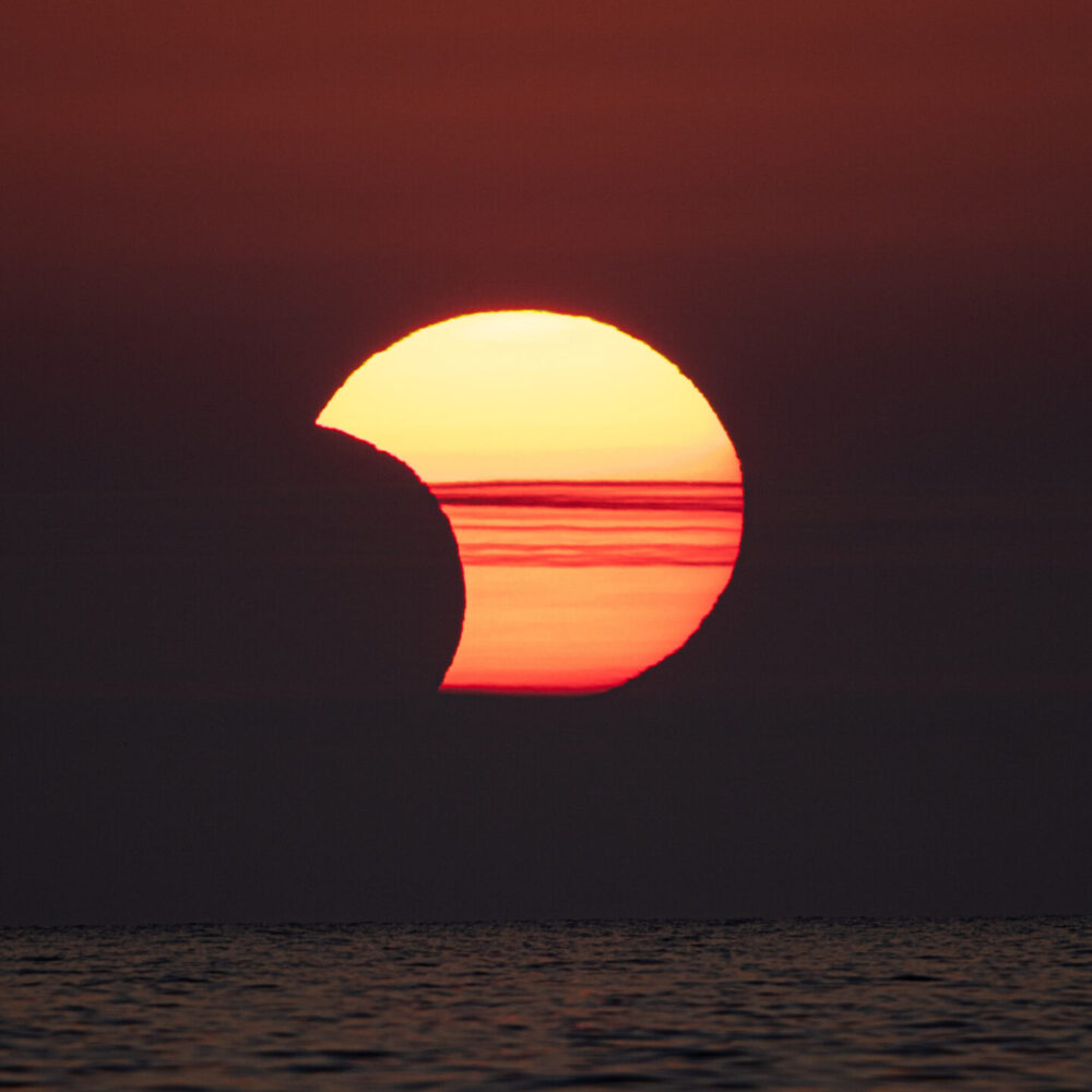Where will the partial solar eclipse be visible in March 2025?