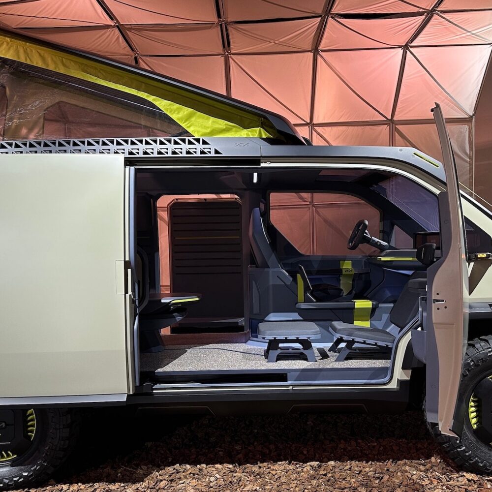 Kia’s wild concept EV includes hydro-turbine wheels, solar panels, and a rooftop tent