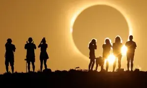 In pictures: Spectators watch in wonder as rare total solar eclipse plunges Spain into darkness